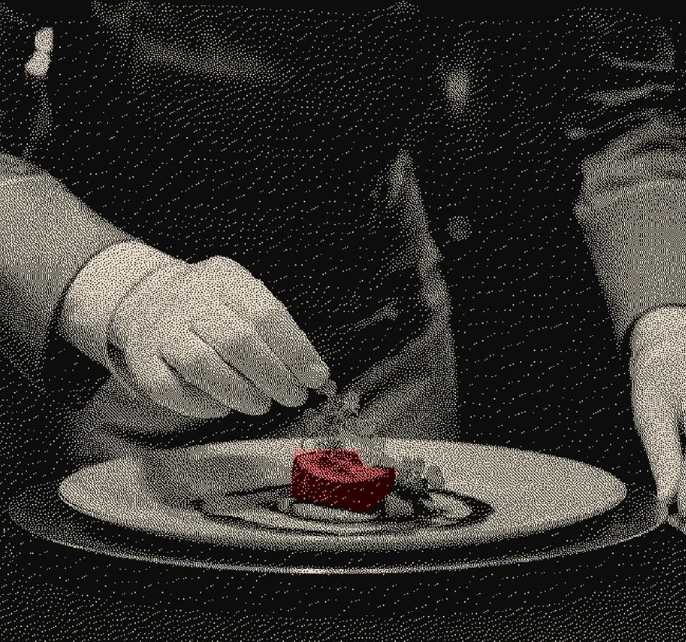 Gloved hands setting the last element on a plated dessert